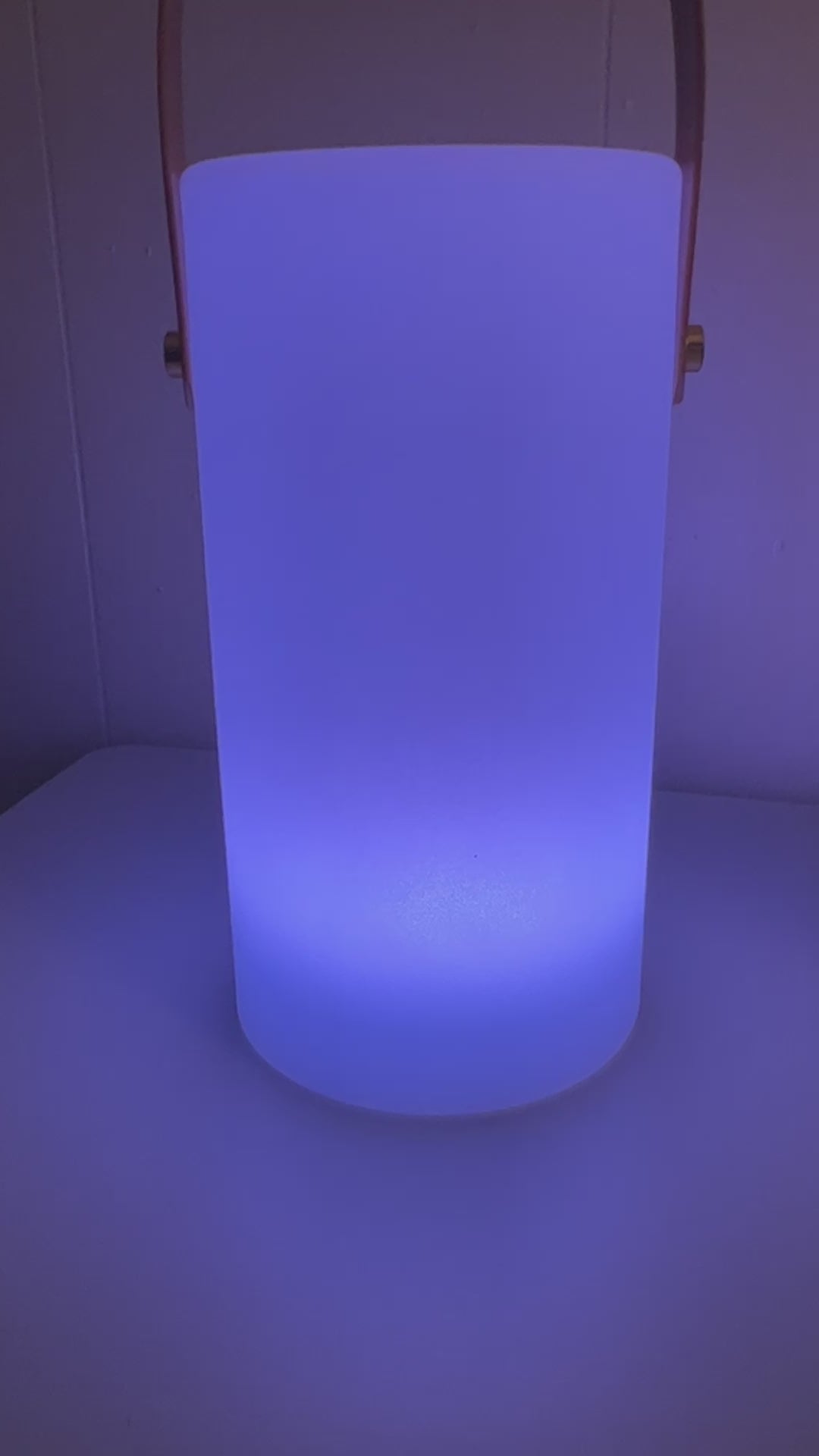 HD Designs Solar Color Changing Lantern illuminated in blue light in a dark room Video
