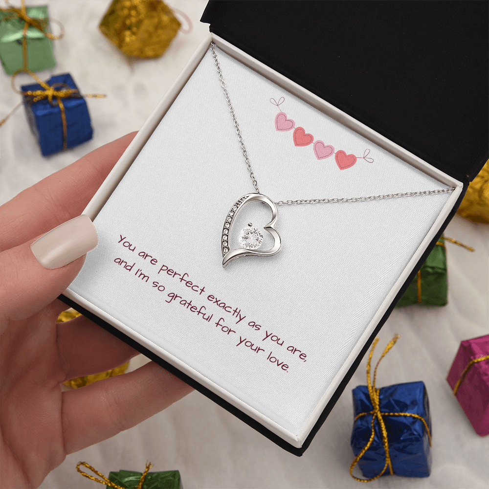Perfectly You Heart Necklace in silver on display with small wrapped gift boxes