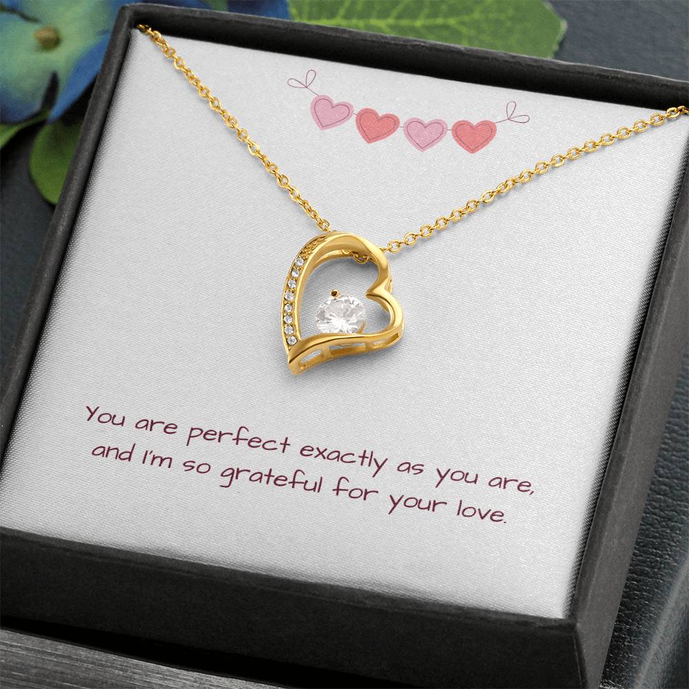 Gold Perfectly You Heart Necklace displayed open in dark wood jewelry box